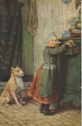 Hund mit Frau in der Küche